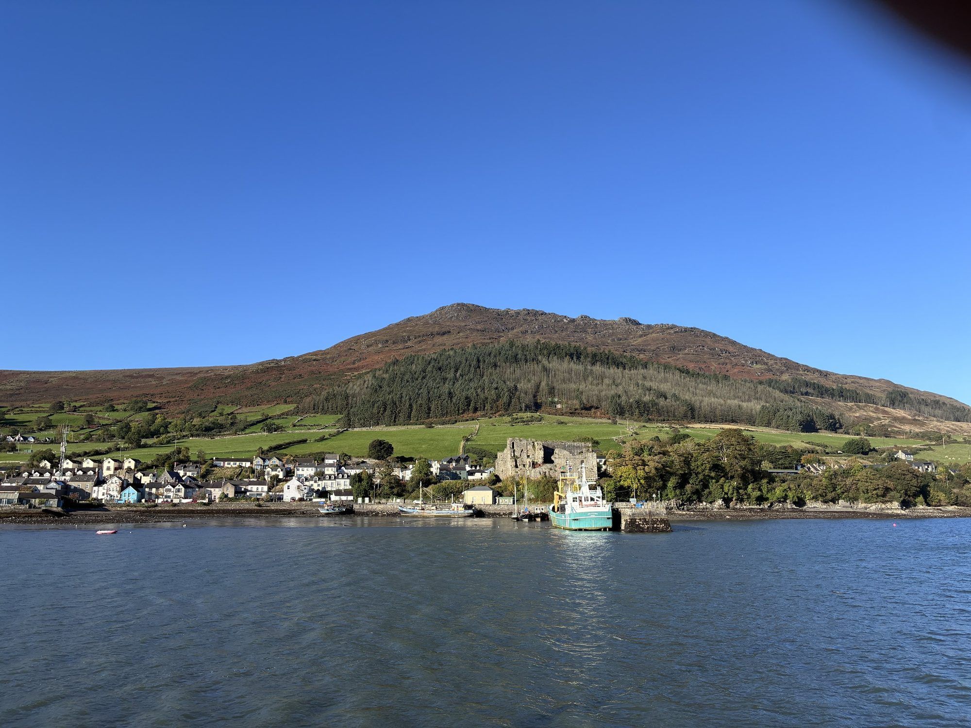 Carlingford village on the lough shore beneath Slieve Foye in the Cooley Mountains