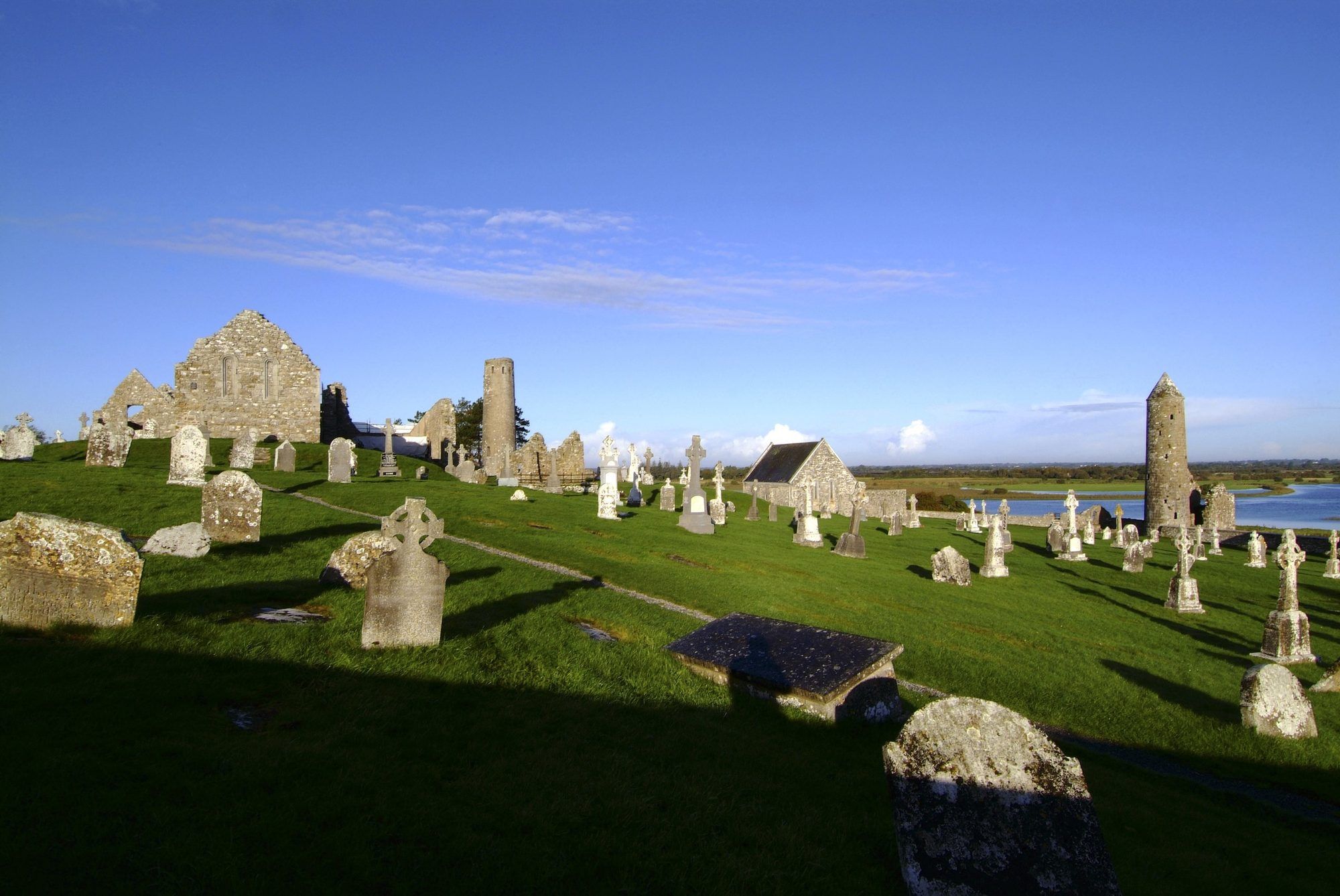 The round tower, high crosses and ruined churches of Clonmacnoise beside the Shannon