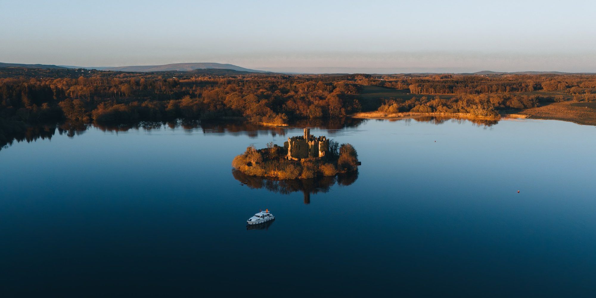 McDermott’s Castle on its island in Lough Key, seen from above at dusk