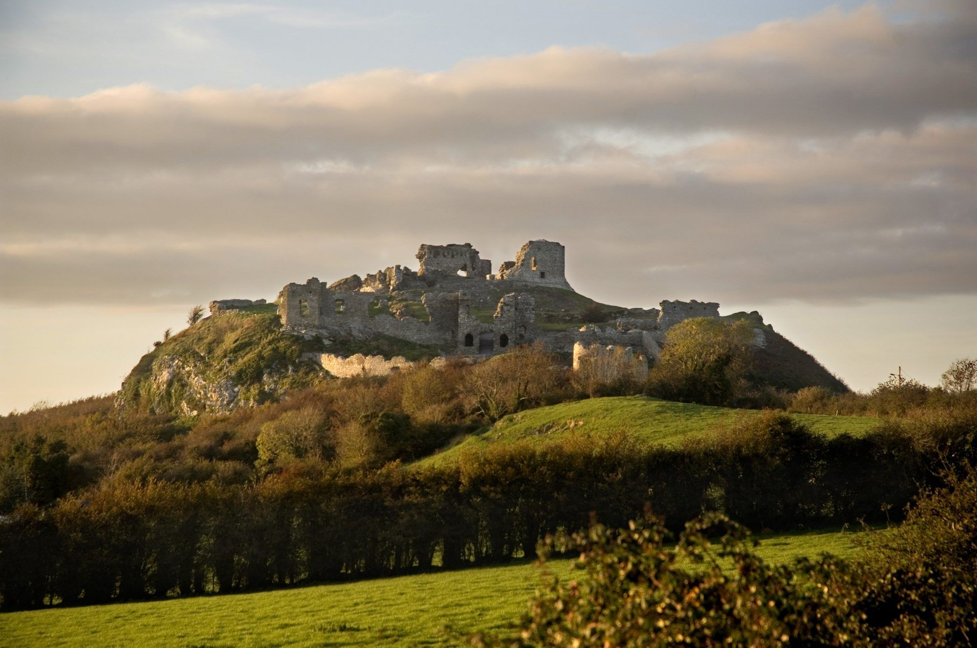 The ruins of the Rock of Dunamase on its hilltop in warm evening light